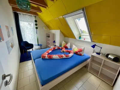 Ein Bett oder Betten in einem Zimmer der Unterkunft Holiday Home Haus Saaler Bodden by Interhome