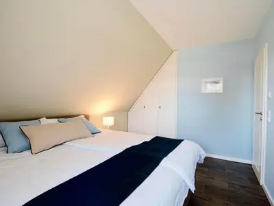 Ein Bett oder Betten in einem Zimmer der Unterkunft Holiday Home Haus Meerblau by Interhome