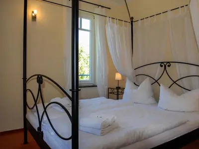 Ein Bett oder Betten in einem Zimmer der Unterkunft Burg Roland Wohnung 03