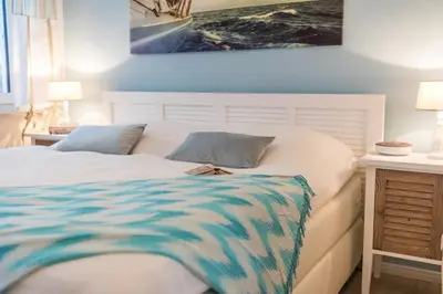 Ein Bett oder Betten in einem Zimmer der Unterkunft Fischers Lütte 08
