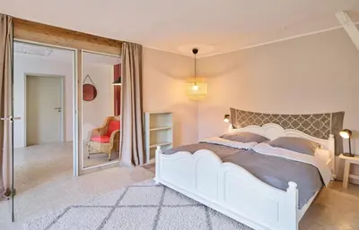 Ein Bett oder Betten in einem Zimmer der Unterkunft Ferienhaus Hängematte für Familien, Freunde und Gruppen