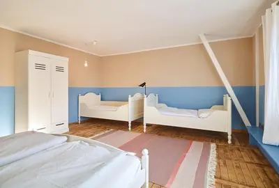 Ein Bett oder Betten in einem Zimmer der Unterkunft Ferienhaus Hängematte für Familien, Freunde und Gruppen