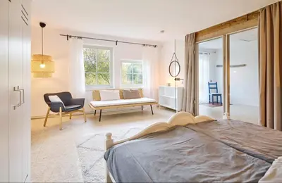 Ein Bett oder Betten in einem Zimmer der Unterkunft Ferienhaus Hängematte für Familien, Freunde und Gruppen