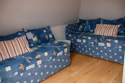 Ein Bett oder Betten in einem Zimmer der Unterkunft Strandstr 4b 