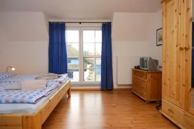 Ein Bett oder Betten in einem Zimmer der Unterkunft Strandmuschel