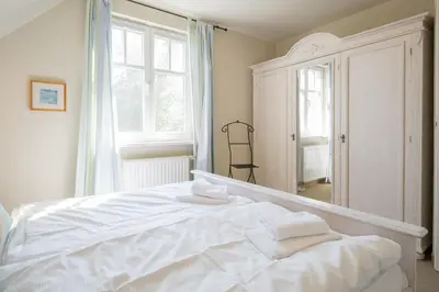 Ein Bett oder Betten in einem Zimmer der Unterkunft Ferienhaus WERDER