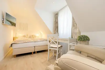 Ein Bett oder Betten in einem Zimmer der Unterkunft Zingster Perle 3