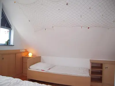 Ein Bett oder Betten in einem Zimmer der Unterkunft Ferienwohnung Seepferdchen