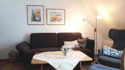 Ein Sitzbereich in der Unterkunft Achtern Diek Haus 7 Wohnung 7