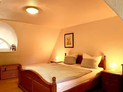 Ein Bett oder Betten in einem Zimmer der Unterkunft Achtern Diek Haus 7 Wohnung 7
