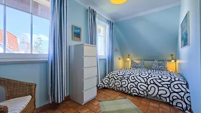 Ein Bett oder Betten in einem Zimmer der Unterkunft Tandem Felix - Ferienhaus in Zingst für bis zu 6 Personen