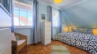 Ein Bett oder Betten in einem Zimmer der Unterkunft Tandem Felix - Ferienhaus in Zingst für bis zu 6 Personen
