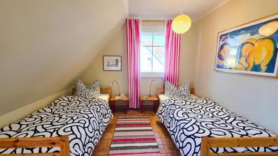Ein Bett oder Betten in einem Zimmer der Unterkunft Tandem Felix - Ferienhaus in Zingst für bis zu 6 Personen
