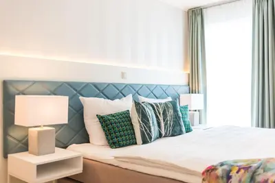 Ein Bett oder Betten in einem Zimmer der Unterkunft Am Park 24