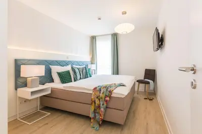 Ein Bett oder Betten in einem Zimmer der Unterkunft Am Park 13