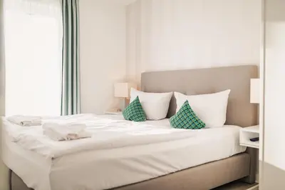 Ein Bett oder Betten in einem Zimmer der Unterkunft Am Park 21