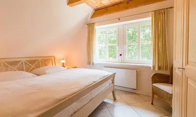 Ein Bett oder Betten in einem Zimmer der Unterkunft Dat Fachwerkhus 02