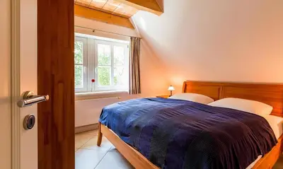 Ein Bett oder Betten in einem Zimmer der Unterkunft Dat Fachwerkhus 02