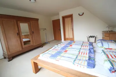 Ein Bett oder Betten in einem Zimmer der Unterkunft Feriendomizil am Hafen