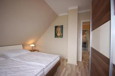 Ein Bett oder Betten in einem Zimmer der Unterkunft Ferienhaus Uhlenhus