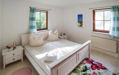 Ein Bett oder Betten in einem Zimmer der Unterkunft Amazing Home In Prerow With Wifi