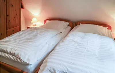 Ein Bett oder Betten in einem Zimmer der Unterkunft Gorgeous Apartment In Prerow With Wifi
