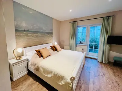 Ein Bett oder Betten in einem Zimmer der Unterkunft Haus Nordlicht
