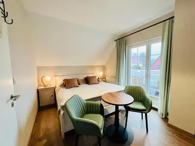 Ein Bett oder Betten in einem Zimmer der Unterkunft Haus Nordlicht