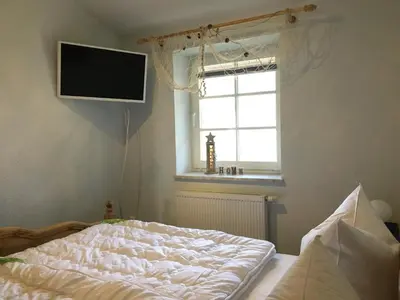 Ein Bett oder Betten in einem Zimmer der Unterkunft Haus Hugo