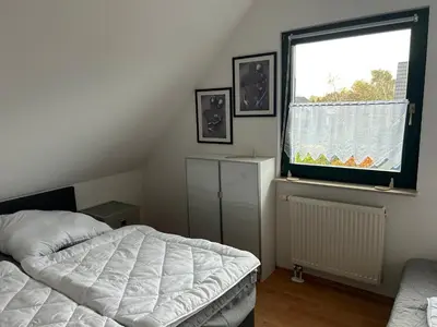 Ein Bett oder Betten in einem Zimmer der Unterkunft Ferienhaus Darß Fischland