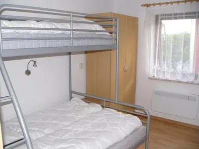 Ein Bett oder Betten in einem Zimmer der Unterkunft Ferienwohnanlage Jan