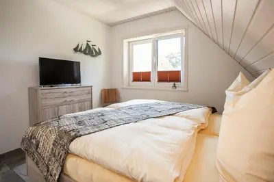 Ein Bett oder Betten in einem Zimmer der Unterkunft Ferienhaus Tura