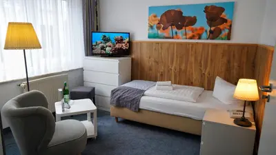 Ein Bett oder Betten in einem Zimmer der Unterkunft Hotel & Restaurant Seebrücke