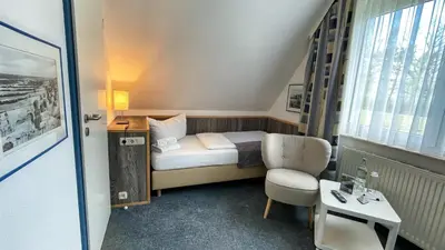 Ein Bett oder Betten in einem Zimmer der Unterkunft Hotel & Restaurant Seebrücke