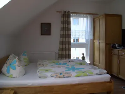 Ein Bett oder Betten in einem Zimmer der Unterkunft Ferienhaus Kaptein Meyer