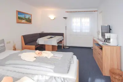 Ein Bett oder Betten in einem Zimmer der Unterkunft Ferienwohnungen Thorsten Fründt