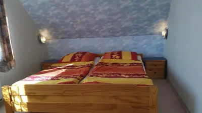 Ein Bett oder Betten in einem Zimmer der Unterkunft An der Sonnenwiese