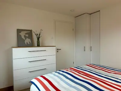 Ein Bett oder Betten in einem Zimmer der Unterkunft H24ZINGST - Das Ferienhaus