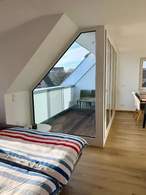 Ein Bett oder Betten in einem Zimmer der Unterkunft H24ZINGST - Das Ferienhaus