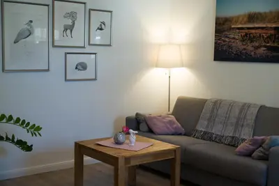 Ein Sitzbereich in der Unterkunft H24ZINGST - Das Ferienhaus
