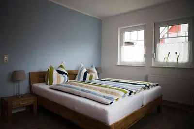 Ein Bett oder Betten in einem Zimmer der Unterkunft H24ZINGST - Das Ferienhaus