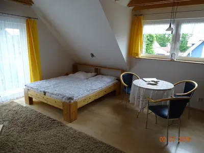 Ein Bett oder Betten in einem Zimmer der Unterkunft Galerie am Hafen