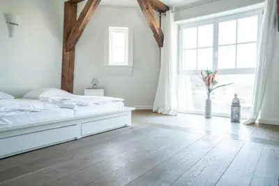 Ein Bett oder Betten in einem Zimmer der Unterkunft Darßer Mühle