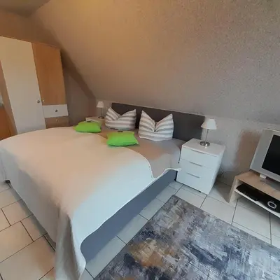 Ein Bett oder Betten in einem Zimmer der Unterkunft Ferienwohnung Greschke