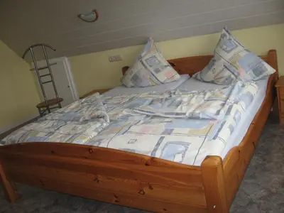 Ein Bett oder Betten in einem Zimmer der Unterkunft Tor zum Darss