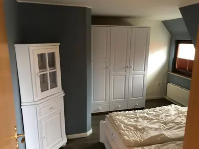 Ein Bett oder Betten in einem Zimmer der Unterkunft ton Timmermanns Hus