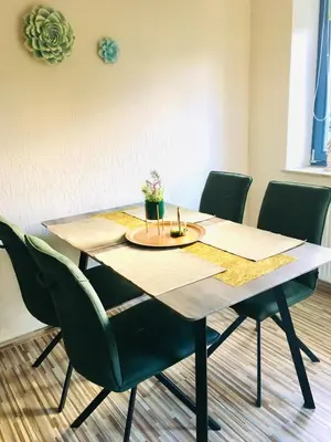 Ein Sitzbereich in der Unterkunft Haus Rose