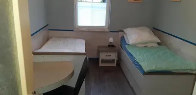 Ein Bett oder Betten in einem Zimmer der Unterkunft Zum alten Seemann