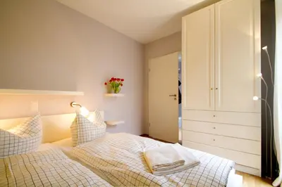 Ein Bett oder Betten in einem Zimmer der Unterkunft Ferienwohnungen Auszeit und Freizeit