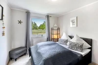 Ein Bett oder Betten in einem Zimmer der Unterkunft Zur Meeresmuschel Nr.10